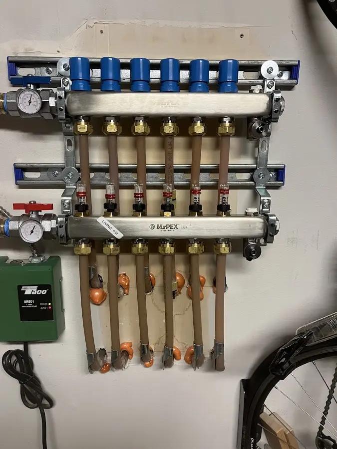 Plumber performing Water Heater Repair at a residential property in Massac